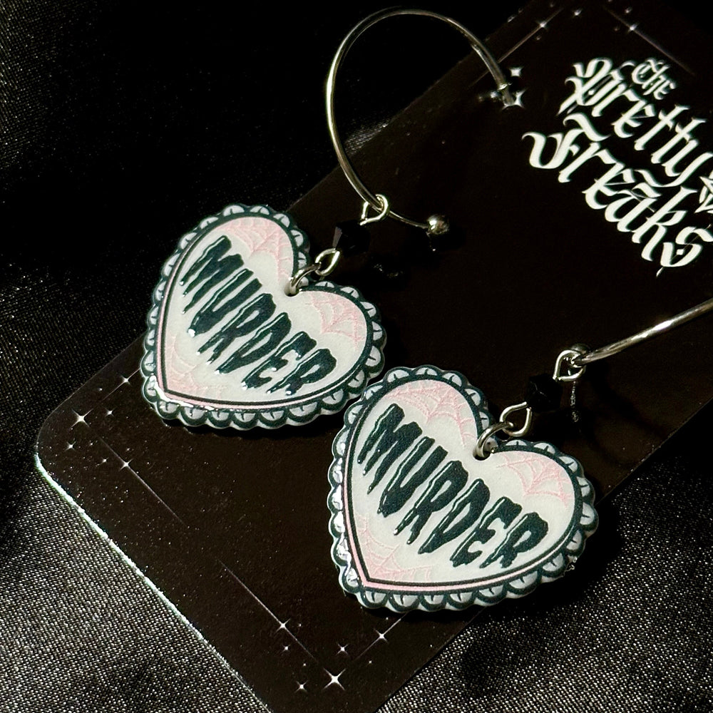 
                      
                        Murder Heart Earrings
                      
                    