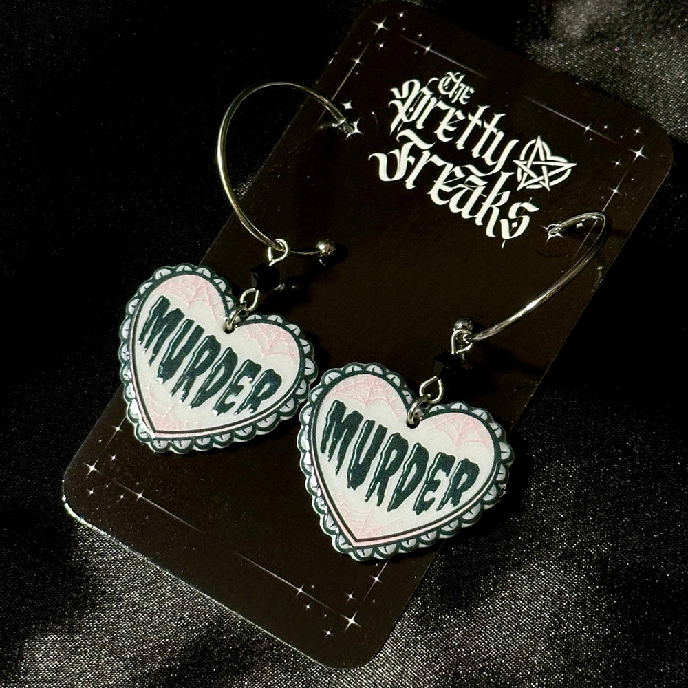 
                      
                        Murder Heart Earrings
                      
                    