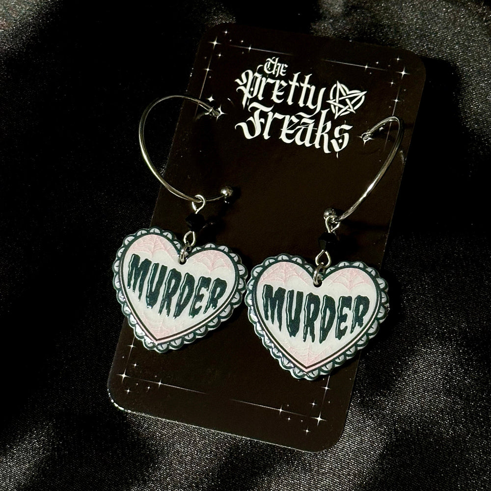 
                      
                        Murder Heart Earrings
                      
                    